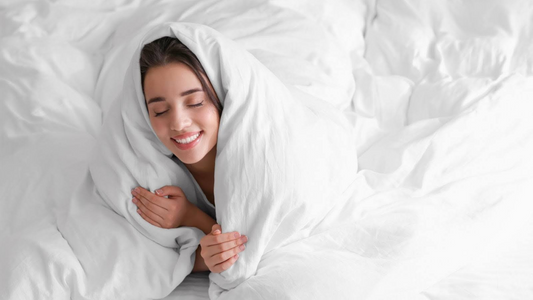 Cozy woman in comforter